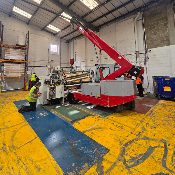 Variable sling rigging configured to balance oil-filled machine section