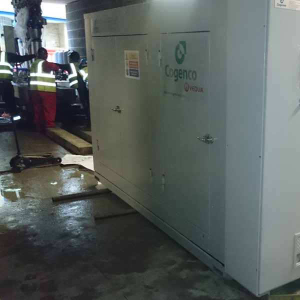 5500kg CHP unit being slid through 40mm clearance basement entrance at 40 Marsh Wall Canary Wharf