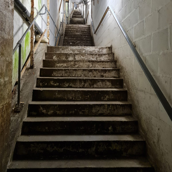 Powered stairclimbing a heavy pump into an underground plant room