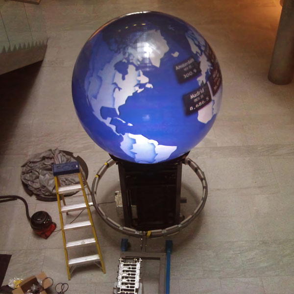 Bespoke fabricated steel trolley with curved bands designed to cradle the projection sphere