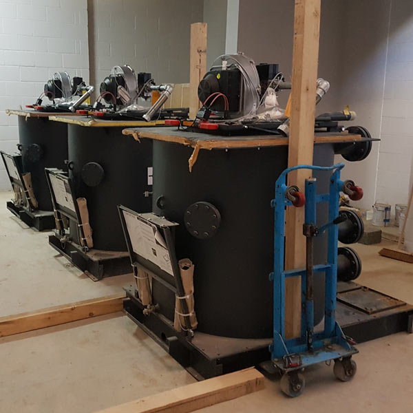 SLS team coordinating a boiler lift with M&E contractors on site