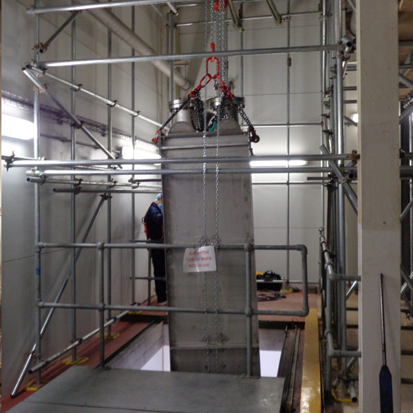 Boiler components being carefully handled during a commercial boiler move